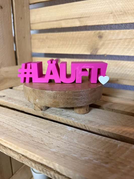 Schriftzug zweifarbig „Läuft"